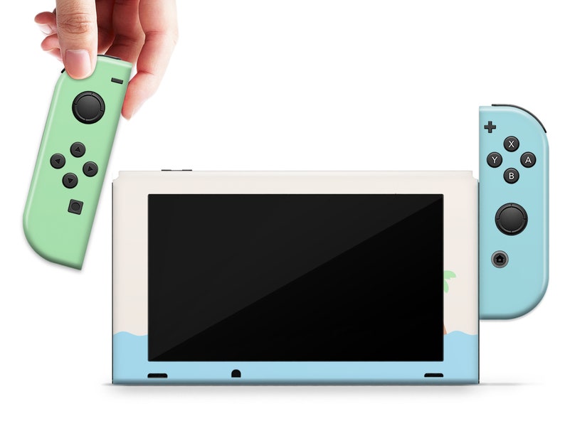 May include: A light blue and white Nintendo Switch console with a green Joy-Con controller. The console has a screen displaying a black background. The Joy-Con controller has a green background with black buttons.