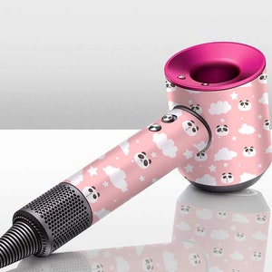 May include: A pink hair dryer with a panda and cloud pattern. The hair dryer has a pink handle and a silver barrel.