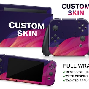 May include: A custom skin set for a games console, featuring a vibrant design of swirling pink and purple colours. The set includes skins for the console, controllers, and a handheld device. The text "CUSTOM SKIN" is displayed on the console and controllers.