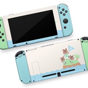 May include: A light blue and green Nintendo Switch console skin with a design featuring Tom Nook and other animal characters from the Animal Crossing video game series. The skin has a white background with a blue ocean wave design and a green palm tree.