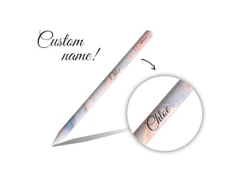 May include: A custom-designed stylus with a marble-like pattern in shades of pink, blue, and white. The name "Chloe" is printed on the stylus. The words "Custom name!" are written in cursive.
