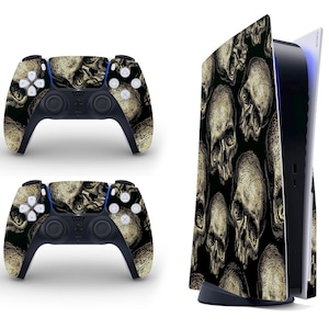 May include: A black PlayStation 5 console and controller with a skull and crossbones design. The console has a black and white skull pattern and the controller has a black and white skull pattern on the front and back.