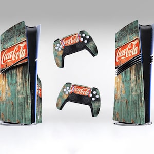 May include: A set of PlayStation 5 consoles and controllers featuring a Coca-Cola design. The consoles have a weathered wood-like texture with the Coca-Cola logo. The controllers have a matching design with the Coca-Cola logo.