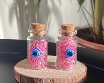 Décoration mauvais œil : bocal en verre rempli de perles roses, Nazar Boncuk turc