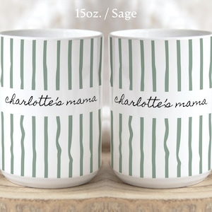 May include: Two white ceramic mugs with a 15oz capacity and a sage green vertical striped pattern. The text 'charlotte's mama' is printed in black script on both sides. Features listed include 100% premium ceramic, smooth glossy finish, dishwasher safe, microwave safe, and lead and BPA free.