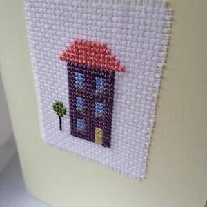 Voltooide kruissteek nieuwe huiskaart - verschillende kleuren