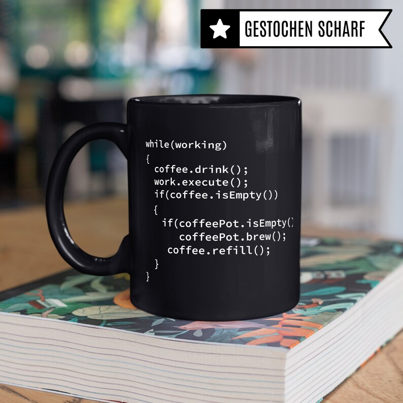 May include: Black coffee mug with white text that reads: "while (working) { coffee.drink(); work.execute(); if(coffee.isEmpty()) { if (coffeePot.isEmpty() coffeePot.brew(); coffee.refill(); } }"