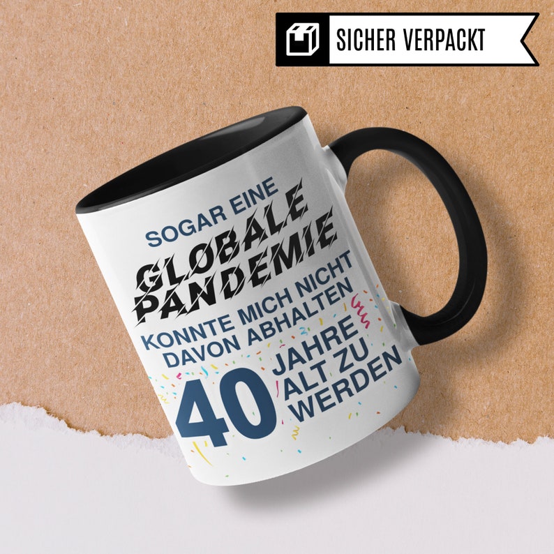 May include: White ceramic mug with a black handle. The mug has a black and white graphic that says "Even a global pandemic couldn't stop me from turning 40 years old".