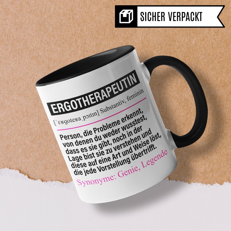 May include: White ceramic mug with a black handle. The mug has black text that reads "ERGOTHERAPEUTIN [ɛʁɡoːtɛʁaˈp&oslash;ːtɪn] Substantiv, feminin Person, die Probleme erkennt, von denen du weder wusstest, dass es sie gibt, noch in der Lage bist sie zu verstehen und diese auf eine Art und Weise l&ouml;st, die jede Vorstellung &uuml;bertrifft. Synonyme: Genie, Legende"