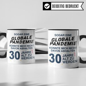 May include: Two white mugs with black handles and black text. The text on the mugs reads "Even a global pandemic couldn't stop me from turning 30." The mugs are decorated with colorful confetti.