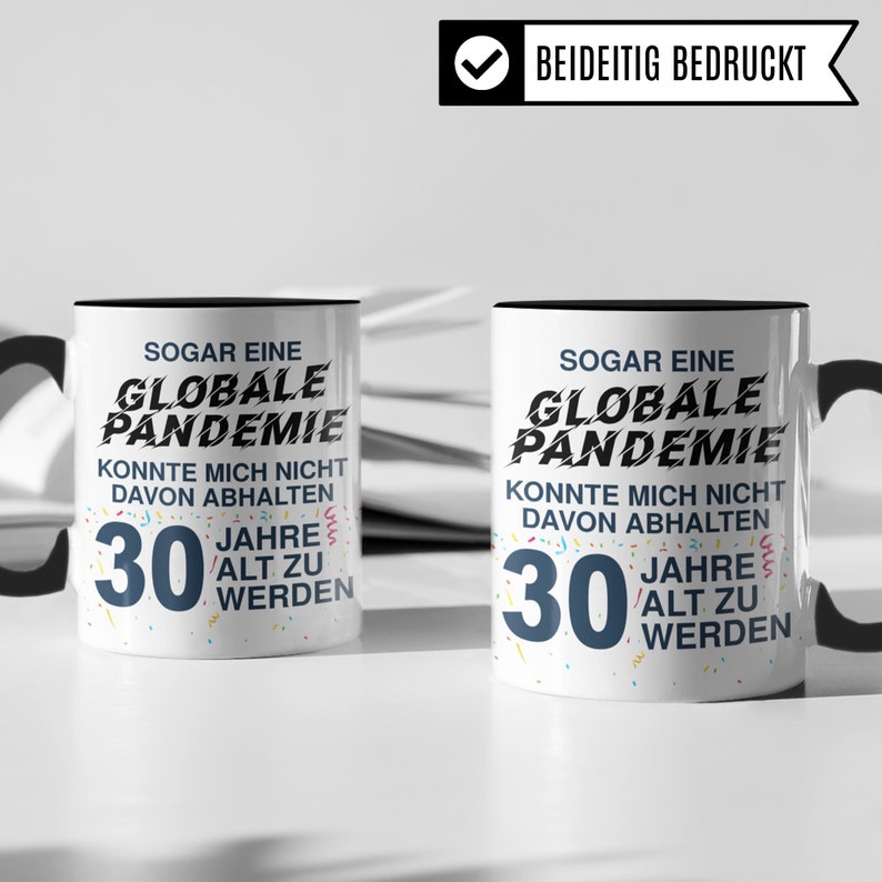 May include: Two white mugs with black handles and black text. The text on the mugs reads "Even a global pandemic couldn't stop me from turning 30." The mugs are decorated with colorful confetti.