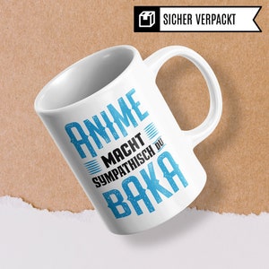May include: White ceramic mug with a blue and black design. The text on the mug reads "Anime Macht Sympathisch Du Baka".