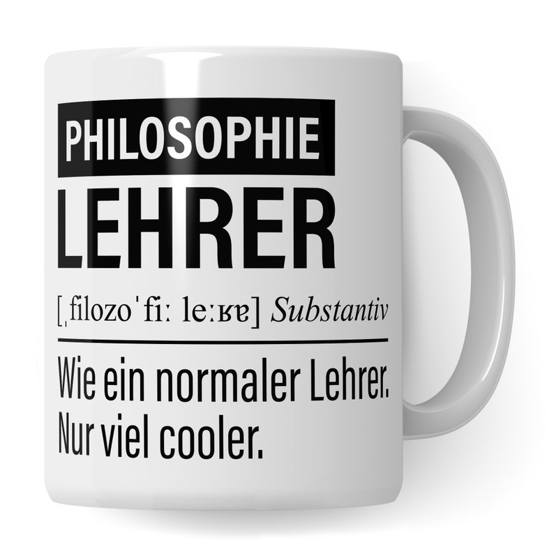 May include: White ceramic mug with black text that reads "PHILOSOPHIE LEHRER [filozo'fi: le:re] Substantiv Wie ein normaler Lehrer. Nur viel cooler."