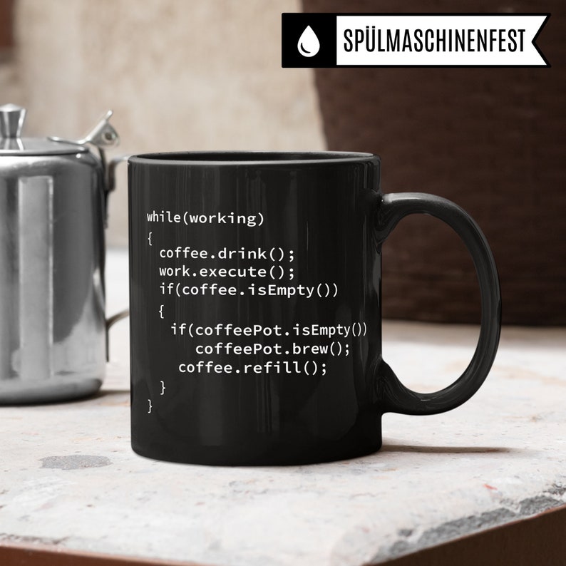 May include: A black coffee mug with white text that reads "while(working) { coffee.drink(); work.execute(); if(coffee.isEmpty()) { if(coffeePot.isEmpty()) coffeePot.brew(); coffee.refill(); } }".