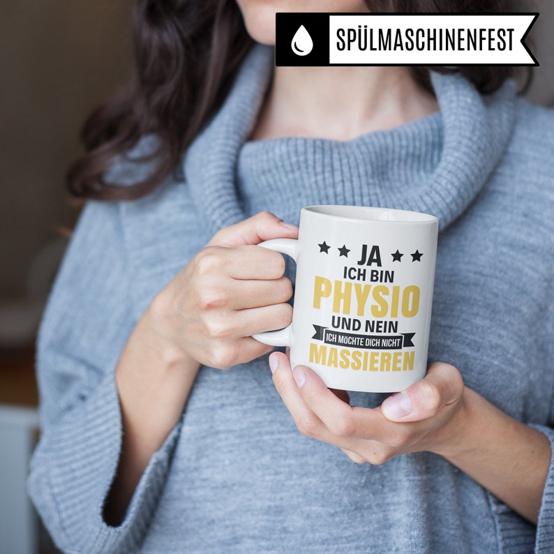 May include: White ceramic mug with a gold design that reads "JA ICH BIN PHYSIO UND NEIN ICH M&Ouml;CHTE DICH NICHT MASSIEREN".