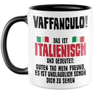 May include: White ceramic coffee mug with a black handle and black rim. The mug features a black and white graphic with the text "VAFFANCULO!" in large bold letters. Below the text is a small Italian flag and the text "DAS IST ITALIENISCH UND BEDEUTET: GUTEN TAG MEIN FREUND, ES IST UNGLAUBLICH SCH&Ouml;N DICH ZU SEHEN".