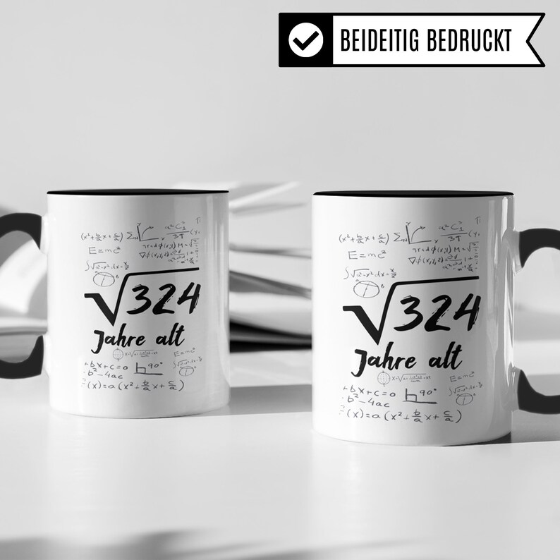 May include: Two white ceramic mugs with black handles and black rims. Both mugs feature a mathematical equation with the square root of 324 and the text "Jahre alt" (German for "years old"). The mugs are printed on both sides.