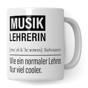 May include: White ceramic mug with black text that reads "MUSIK LEHRERIN [mu'zi:k'le:rǝbın] Substantiv Wie ein normaler Lehrer. Nur viel cooler."