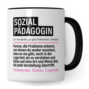May include: White ceramic mug with a black handle. The mug has black text that reads "SOZIAL P&Auml;DAGOGIN" and a definition in German. The definition reads "[zo'tsia:lpeda, go:gın] Substantiv, feminin Person, die Probleme erkennt, von denen du weder wusstest, dass es sie gibt, noch in der Lage bist sie zu verstehen und diese auf eine Art und Weise l&ouml;st, die jede Vorstellung &uuml;bertrifft. Synonyme: Genie, Legende"