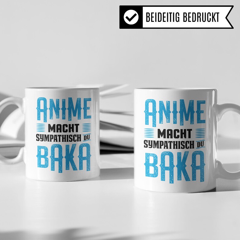 May include: Two white ceramic mugs with blue text that reads "Anime Macht Sympathisch Du Baka".