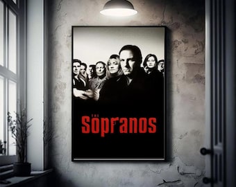 May include: A framed poster featuring the cast of "The Sopranos" against a black background. The show's title, in red, is displayed prominently at the bottom. The image is displayed on a textured wall, with a hanging light above.