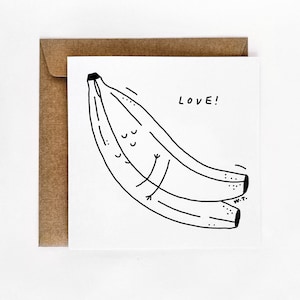 May include: A black and white illustration of two bananas with the word "LOVE!" written above them.