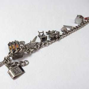 Vintage Sterling SILVER 7" Charm Bracelet with 11 silver Charms in Which 6 are Movable