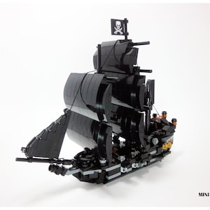 May include: A black LEGO model of the Black Pearl pirate ship from the Pirates of the Caribbean movie franchise. The ship has a black hull, black sails, and a skull and crossbones flag. The ship is built with LEGO bricks and is a miniature version of the real ship.