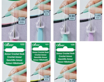 May include: Set of ten Clover Amour crochet hooks in various sizes, ranging from 0.60 mm to 1.75 mm. Each hook is packaged individually with a green and white label that includes the Clover logo, the hook size, and the product name in multiple languages.