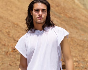 May include: A white sleeveless hooded tunic featuring an attached hood and side ties at the waist, paired with matching white trousers. The tunic is constructed from a lightweight, semi-sheer fabric with a loose, relaxed fit and an asymmetrical hemline.