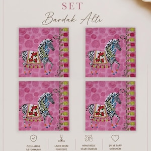 May include: A set of four square coasters featuring a pink background with a repeating rose pattern and a central illustration of a zebra wearing a decorative blanket with red flowers. The text 4'LÜ SET Bardak Altı and LaMua Home is visible.