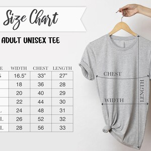 May include: A light gray adult unisex tee shirt hanging on a wooden hanger. The image includes a size chart with measurements in inches for width, chest, and length. The chart is labeled "Size Chart" and "ADULT UNISEX TEE".