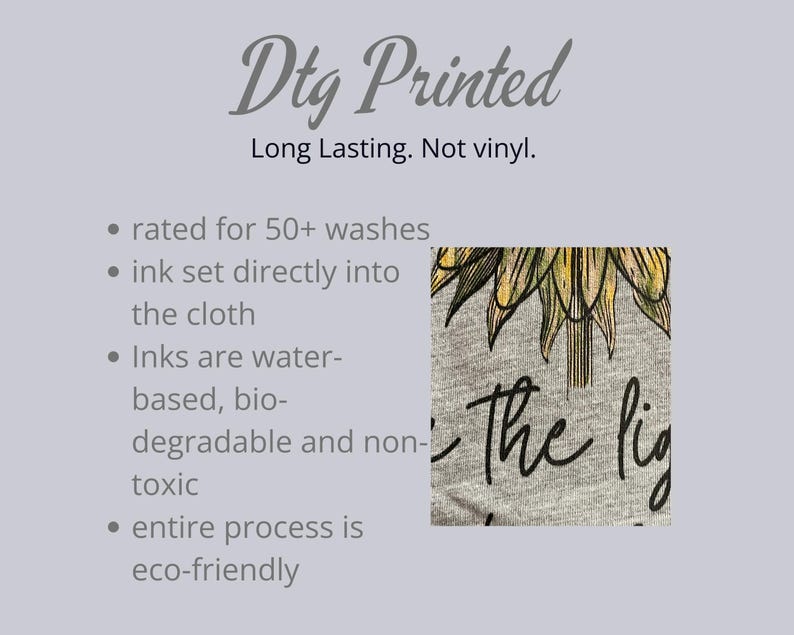 May include: A gray t-shirt with a sunflower design and the words "the light". The image also includes text stating the shirt is DTG printed, long lasting, and eco-friendly. The ink is water-based and non-toxic.