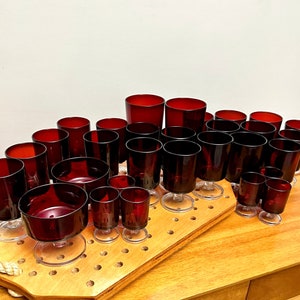 1970s Luminarc Cavalier Ruby Red Glass Sets | Arcoroc Footed Stemware Various Sizes | MCM Cristal D&#39;Arques Durand Clear Stem Red Glassware