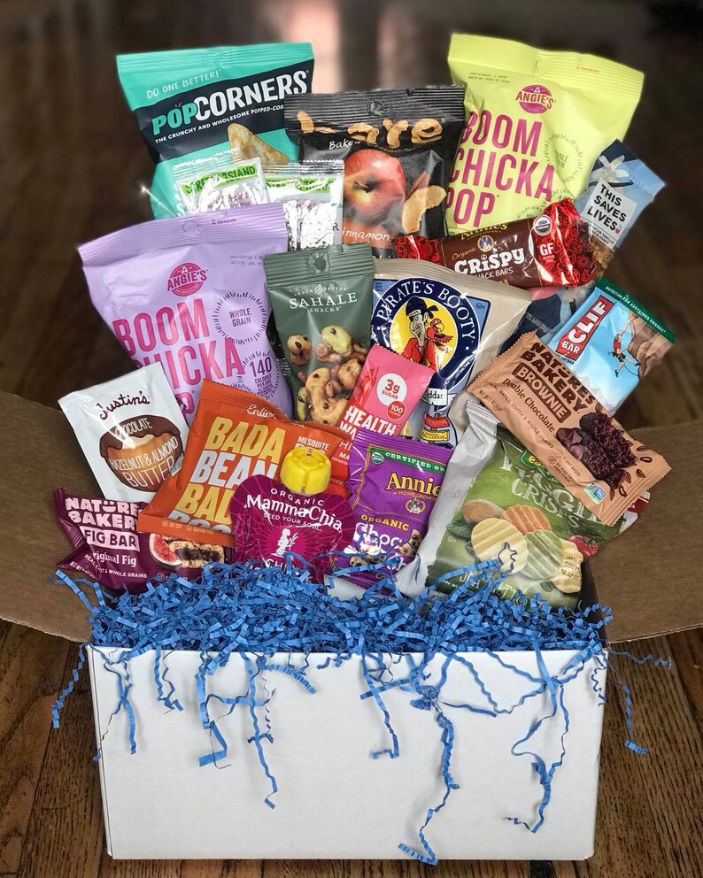 18 College Care Packages for Guys That Will Instantly Light Up His Day 17 care package with assorted healthy food and snacks