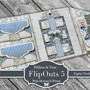 May include: Open scrapbook with blue and white striped pockets and a central butterfly design. The scrapbook features a floral pattern and includes tags and decorative elements. The text "Willow & Vine FlipOuts 5" is visible.