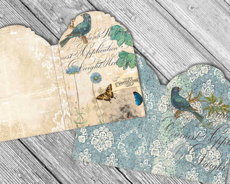 May include: A vintage-style card with a blue bird, butterfly, and floral design. The card is folded in half and has a blue and white patterned background.