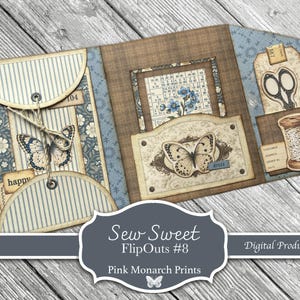 May include: A tri-fold paper craft project featuring blue and cream striped pockets, brown plaid panels, and floral patterns. Embellishments include butterfly illustrations, a vintage spool of thread, scissors, and the text labels happy, 104, and 40028.