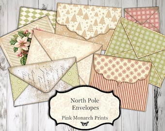 May include: Set of vintage-style envelopes with a North Pole theme. The envelopes feature a variety of patterns, including snowflakes, stars, and a floral design. The envelopes are printed with the text "North Pole Envelopes" and "Pink Monarch Prints".