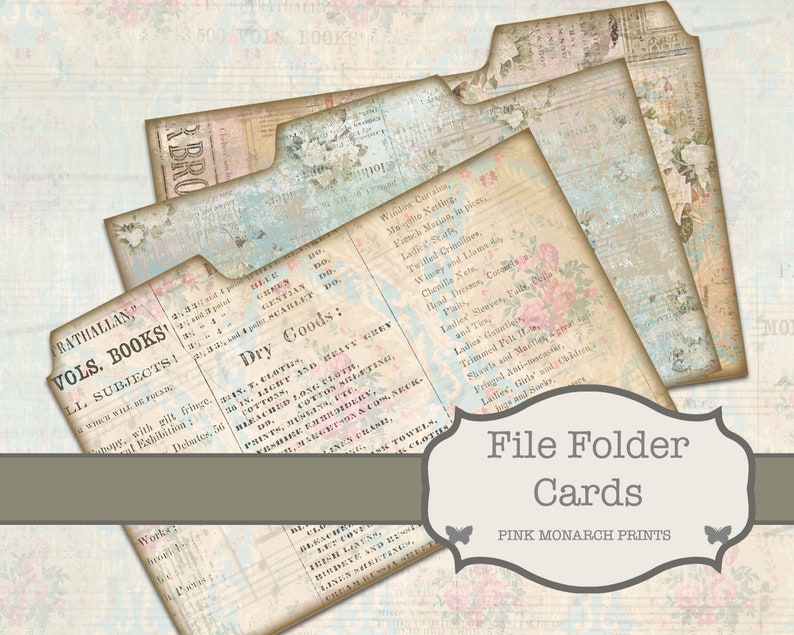 Op de afbeelding: Drie vintage map-kaarten met een verweerde, oude uitstraling. De kaarten zijn versierd met bloemmotieven en tekst, waaronder "RATHALLAN", "VOLS. BOOKS", "LL SUBJECTS" en "Dry Goods". De kaarten zijn gelabeld met "File Folder Cards" en "PINK MONARCH PRINTS".