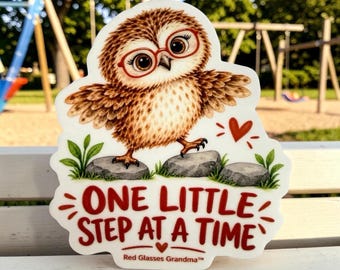 May include: A die-cut sticker featuring a brown owl with large eyes wearing red glasses, standing on gray stones with green leaves. The text reads ONE LITTLE STEP AT A TIME and Red Glasses Grandma. A small red heart is positioned near the owl.