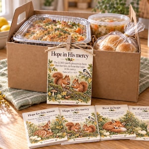 AI-generated lifestyle mockup of a woodland squirrel Bible verse card attached to a meal delivery box, with all four encouragement card designs stacked on a table. Digital cards only; meal, box, and props are not included.