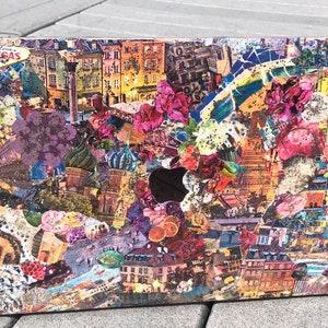 May include: A laptop computer with a colorful collage of images and text covering the exterior. The collage includes images of buildings, flowers, and other objects. The text includes the words "Las Vegas" and Japanese characters.