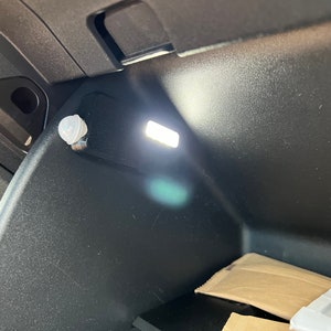 The GlowBoxLite v4, Motion activated glove box light. Designed for VW ID.3,4,5 or Buzz but will fit any car.