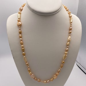 Silk knotted cream colored freshwater pearl necklace