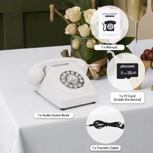May include: A white retro telephone with a rotary dial is displayed on a white surface. The image includes a manual, a TF card, and a transfer cable. A floral arrangement and a champagne glass are in the background.