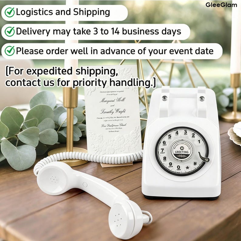 May include: A white vintage rotary phone with a matching handset rests on a wooden surface. The phone features a circular dial with numbers and the word "GREETING". A wedding invitation is behind the phone. The image also includes text about logistics.