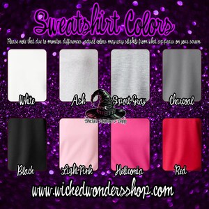 May include: A chart showing the different color options for sweatshirts. The colors are: white, ash, sport gray, charcoal, black, light pink, heliconia, and red. The text "Sweatshirt Colors" is at the top of the chart. The text "Please note that due to monitor differences actual colors may vary slightly from what appears on your screen." is below the chart. The text "www.wickedwondersshop.com" is at the bottom of the chart.