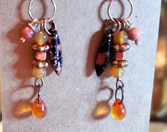 Bohemian style earrings, black & orange Czech dagger, orange teardrop beads.