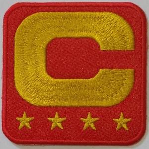 May include: Red embroidered patch with a large gold letter "C" and four gold stars below.
